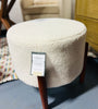Elroy faux shearling round ottoman with wood legs SHOWROOM ITEM