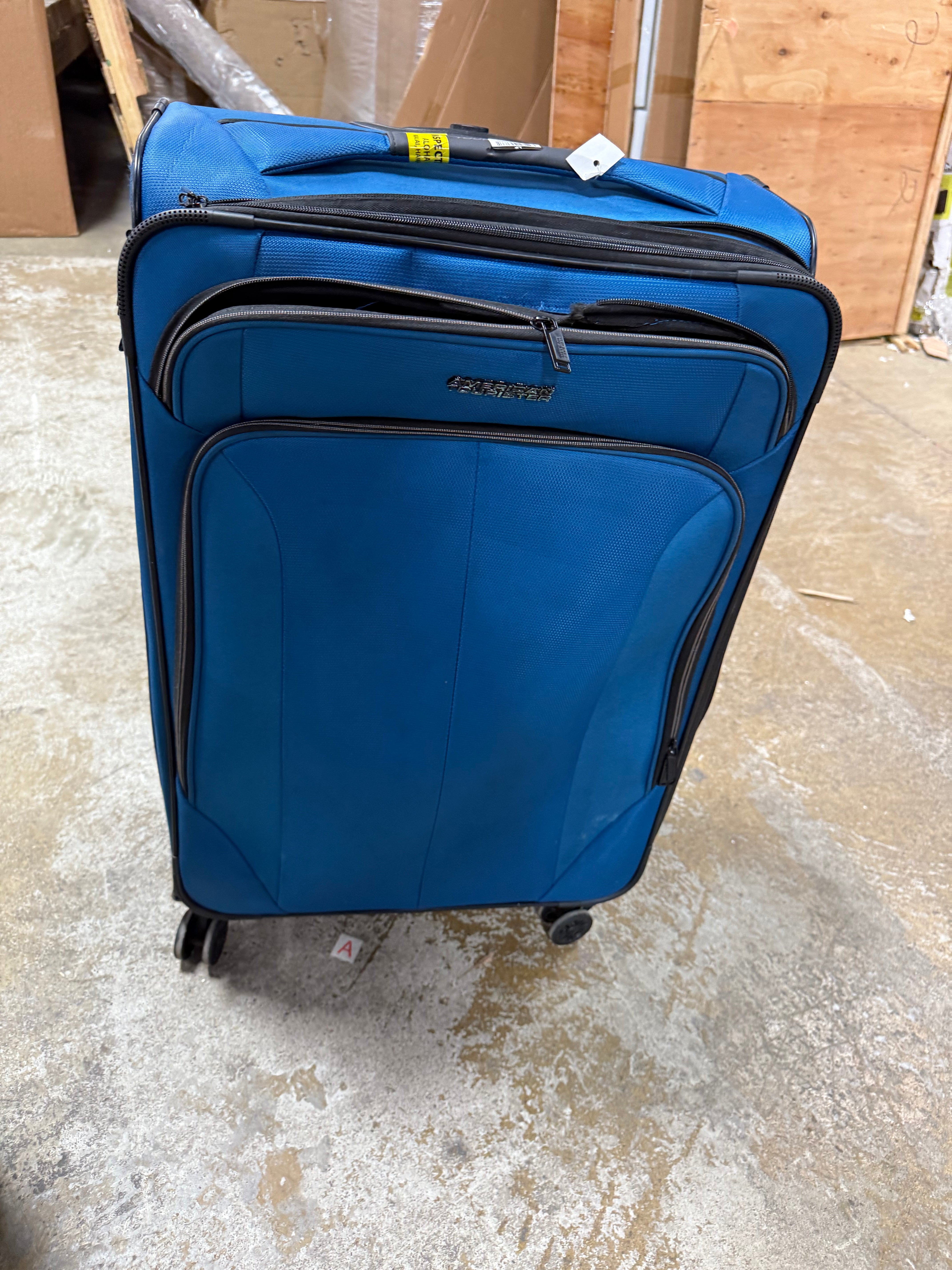 Phenom Softside Carry On Spinner Suitcase